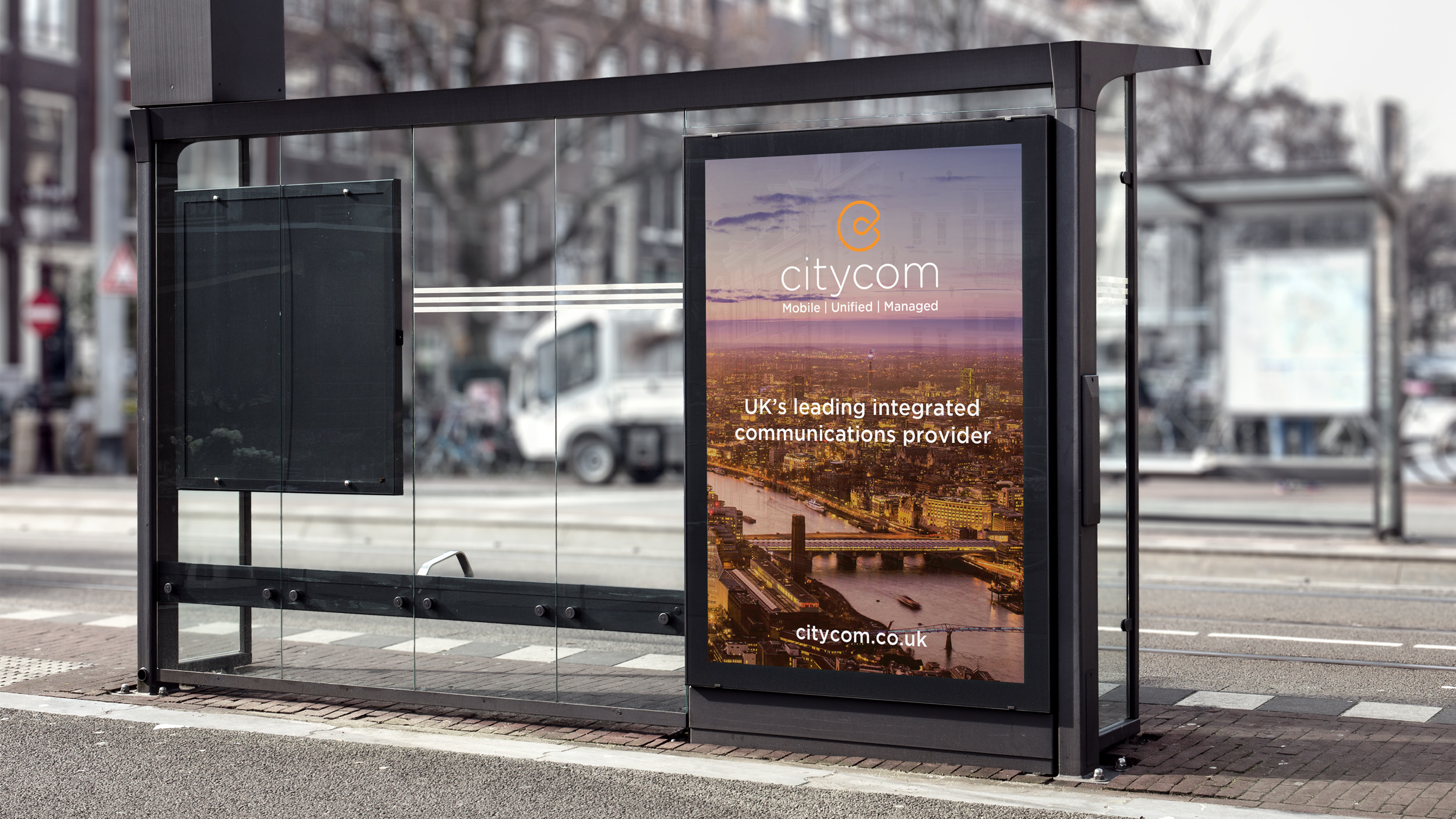 Citycom advert in situ on the side of a tram stop