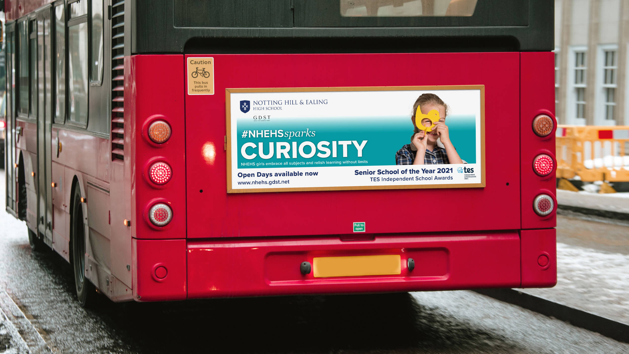 Notting Hill & Ealing High School for Girls 'Sparks Curiosity' campaign poster on a bus rear